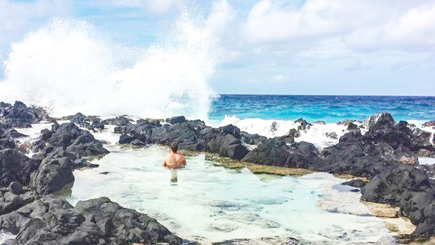 Man in a tide pool in Fitiuta, Manu'a