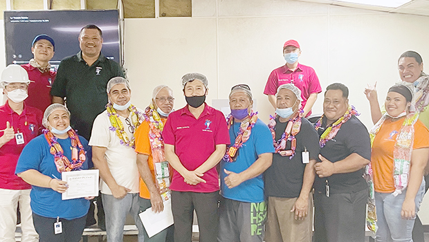 some of their recipients with their supervisors and managers, led by General Manager Jason Kim