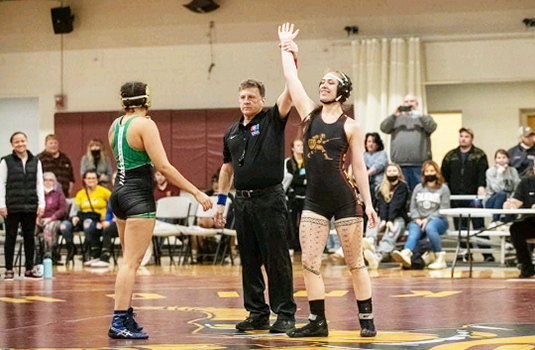 Stephanie Floor (far right) winning one of her wresting tournaments