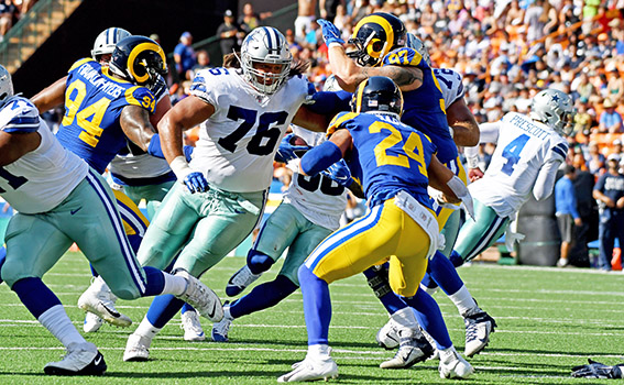 Offensive Guard, Xavier Sua-Filo, protects his QB Dak Prescott 