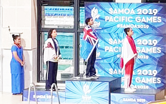 Tilali Scanlan on the pdoium after winning her silver medal with gold winner Moana Wind and bronze, Poerani Bertrand