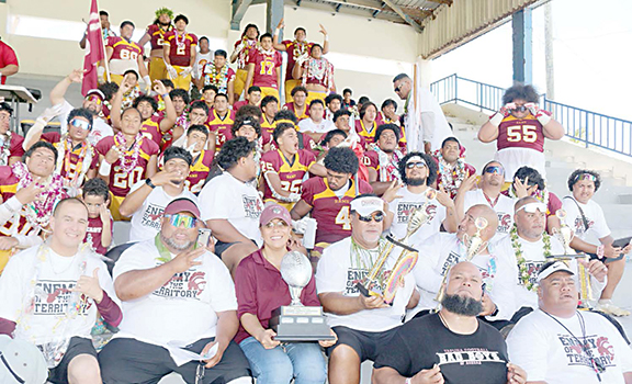 The Warriors football team and coaches