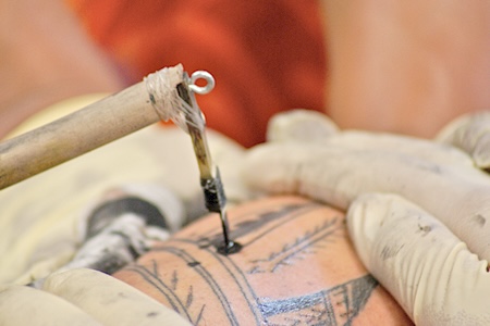 tattoo implement being used