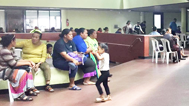 People waiting to be called for their turn at the Tax Office