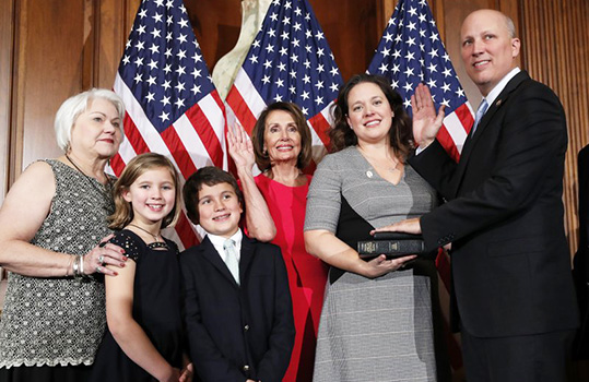 In this AP file photo, House Speaker Nancy Pelosi of Calif., left, poses during a ceremonial swearing-in with Rep. Chip Roy, R-Texas, right