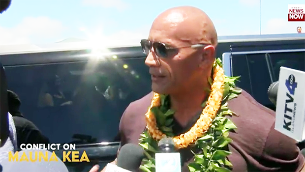 The Rock speaks to reporters during his visit to TMT protest