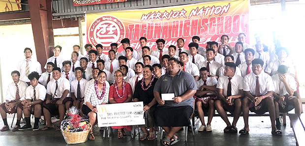  Pictured are the Warriors football players with school principal Tutuila Togilau, Head Coach  Kevin Magalei and McDonald’s reps Dolores Tautolo and Katie Leilua. 