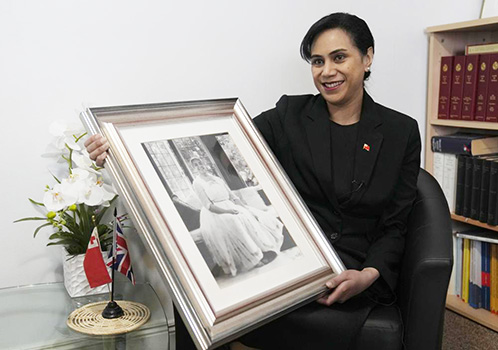 Tonga High Commissioner to the UK, Titilupe Fanetupouvava'u Tu'ivakano with photo of her great grandmother, Queen Salote