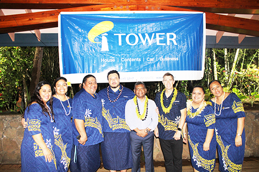 Turnball is pictured with the Tower staff during