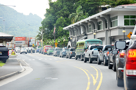 TRAFFIC BACK UP IN FROM OF POST OFFICE BUILDING