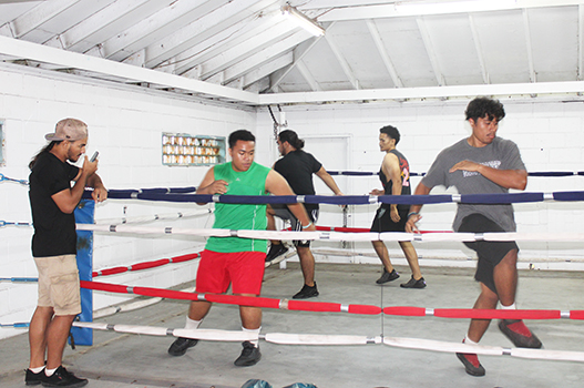 Boxers in a training session in the ring