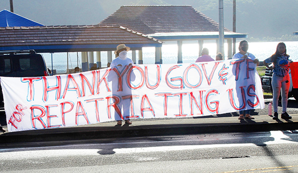 TTFAAS members with thank you banner waving to drivers passing by
