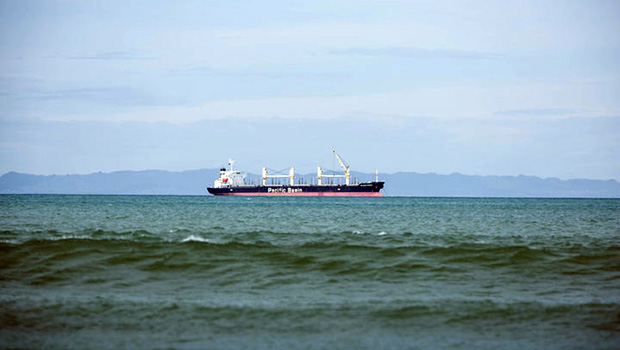 A transshipment vessel off shore of a Pacific island
