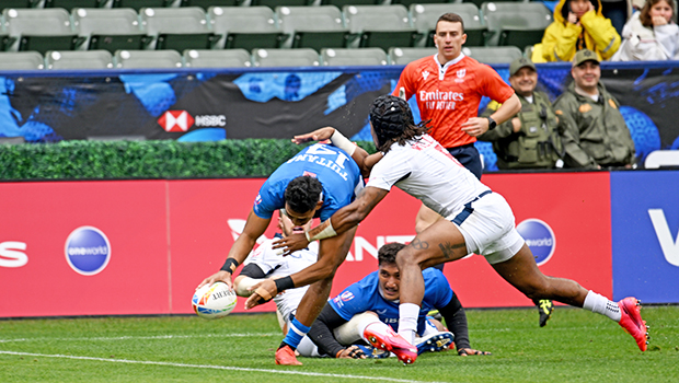 Tuna Tuitama goes over the top of Kevon Williams 