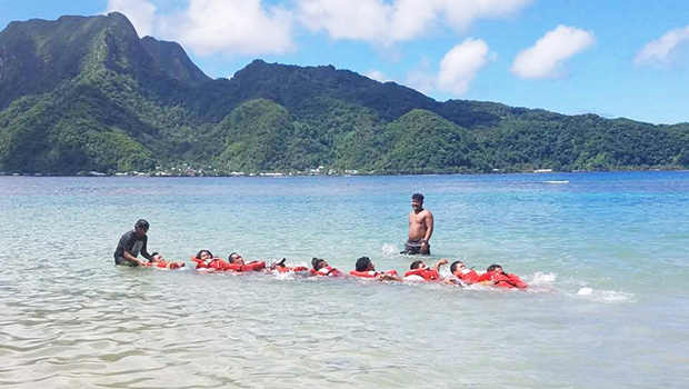 Fishers from the local fleet in American Samoa practice creating a human chain 