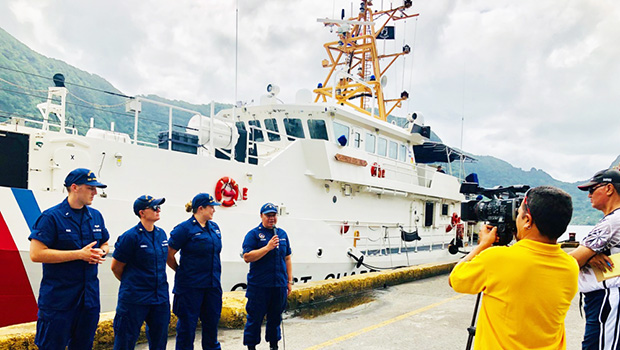 Members of the Coast Guard Cutter Joseph Gerczak and a Coast Guard recruiter give interviews to television reporters in the Port of Pago Pago