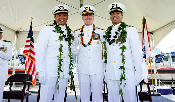 Capt. Arex Avanni (left),Capt. Michael Long (right),Rear Adm. Kevin Lunday (center) 