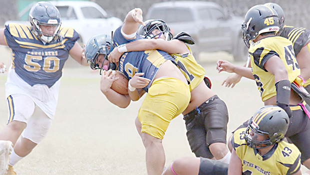Wildcats defender bringing down the Crusaders ball carrier 