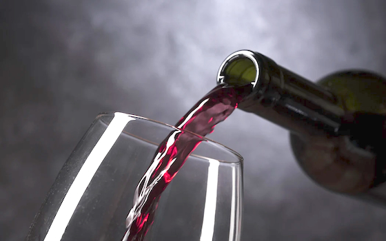 wine being poured into a glass