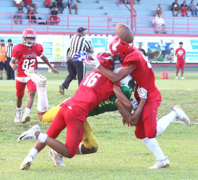 Two Faga’itua Viking defenders break up a pass