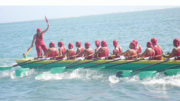 Zita Martel captaining her longboat inside the reef in Samoa.