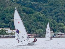 13-year old Junior sailor Carlos Leonel Sanchez of Utulei village leads into the first turn at the red buoy