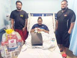 Faaleava Mack of Aasu receiving gifts