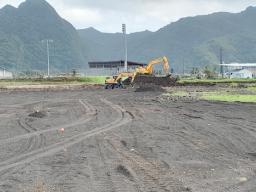 Heavy duty machinery leveling building site
