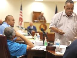 Faipule Suʻa Alex Jennings from the back being bypassed by house clerk