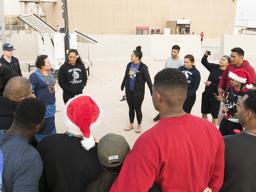 Amata pictured with some of the U.S. Army soldiers from the 962nd Quartermaster Company