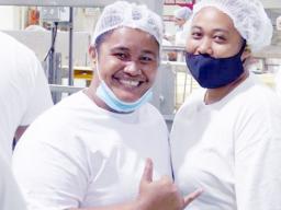 Two woman who work for StarKist Samoa