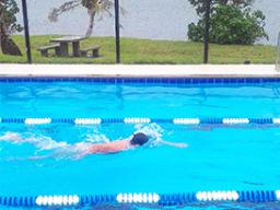 PHS high school student works to perfect his freestyle stroke.