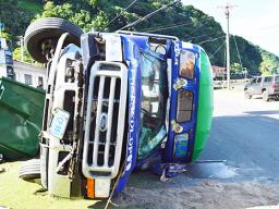 overturned bus in Aua