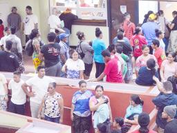 People lining up at Disbursement window to get $100