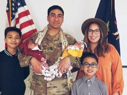 Infantry Drill Sergeant Mumaina Lagai with his wife and children