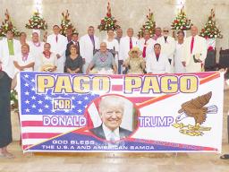 Sen. Tuaolo Manaia Fruean (left) holding the “Pago Pago for Trump” banner with Pulu Ae Ae Jr, while Paramount Chief Mauga T. Asuega, his wife and village traditional and church leaders (on stage)