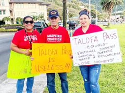 Pago Pago chief Pulu Ae Ae Jr., (middle)  protesters
