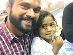 Three-year old Abigail Gaunavou and her father