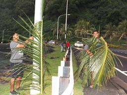employees from the Department of Administrative Services, Housing Division, were seen at Faganeanea in 2019, decorating the roadside,