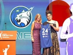 Utah’s Alissa Pili, right, poses for a photo with WNBA commissioner Cathy Engelber