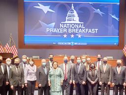 Amata and other Representatives and Senators at the National Prayer Breakfast.