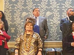Amata standing with other members of Congress