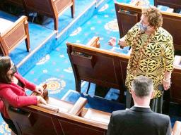 Congresswoman Uifa’atali Amata speaking with an unidentified woman 