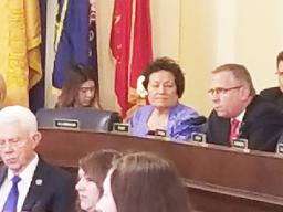 Congresswoman Amata seated by Ranking Member Bost