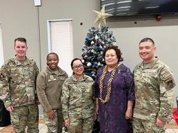Amata with Agueda Vaiola Leleua and other service members