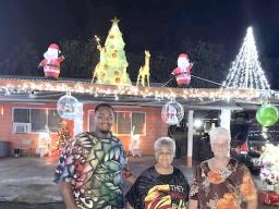 Amiaimalo Ofoia family with Christmas lights