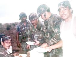 Historical photo of Army Reserve Soldiers from the 100th Infantry Battalion taking a break for a meal