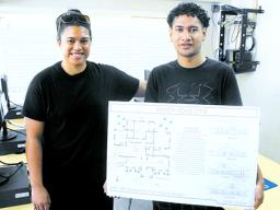 ASCC instructor Valentine Talamoni (left) advises student Henry Aiava on his work 