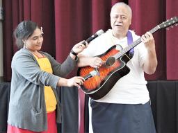 Tapa’au Dr. Dan Aga playing the guitar