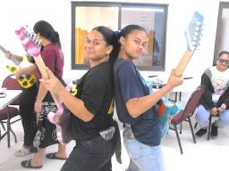 Two students in the STEAM Guitar Building Program